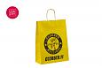 kollased paberkotid | Fotogalerii- kollased paberkotid, millele trkitud klientide logod personali