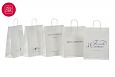 Valged paberist kotid on s.. | Fotogalerii- valged paberkotid, millele trkitud klientide logod va